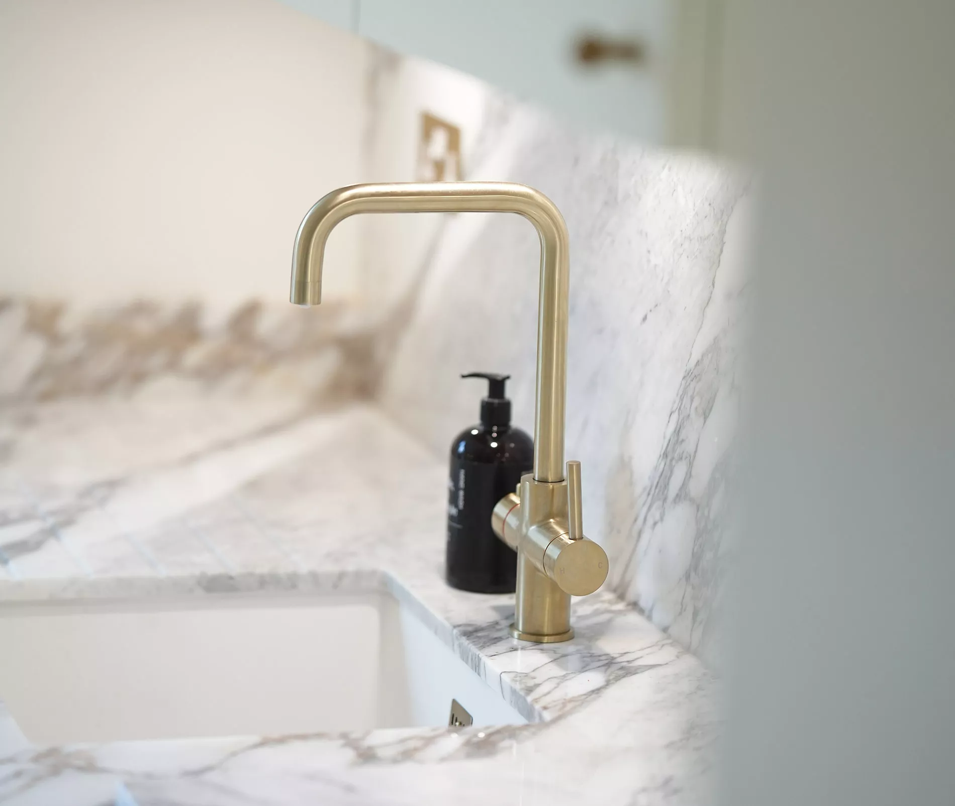 white marble kitchen gold tap