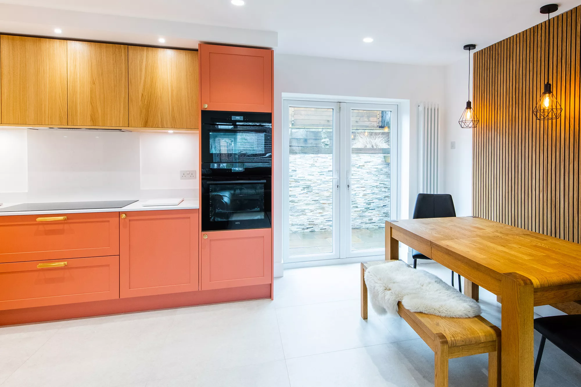 traditional fusion kitchen with orange shaker style cabinets