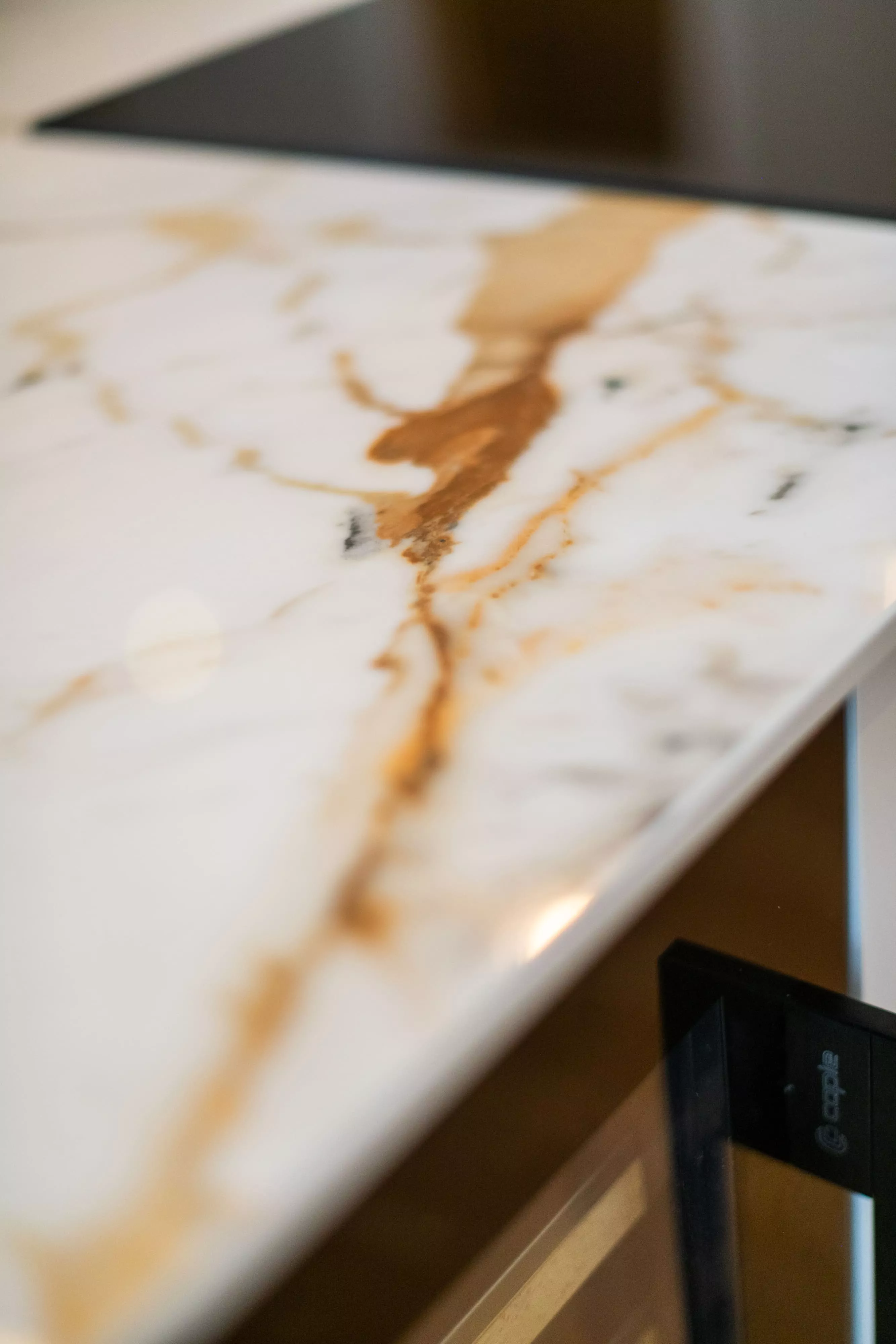 gold marble veined worktop up close